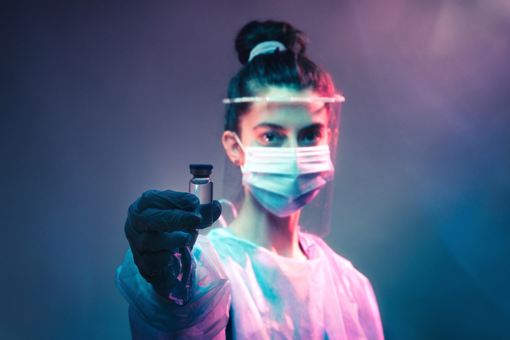 Brave Healthcare Worker Holding Vial of Vaccine