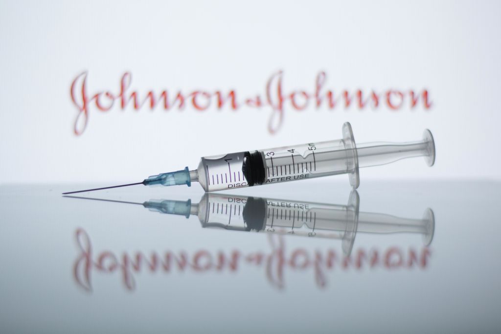 In this photo illustration a medical syringe seen displayed...