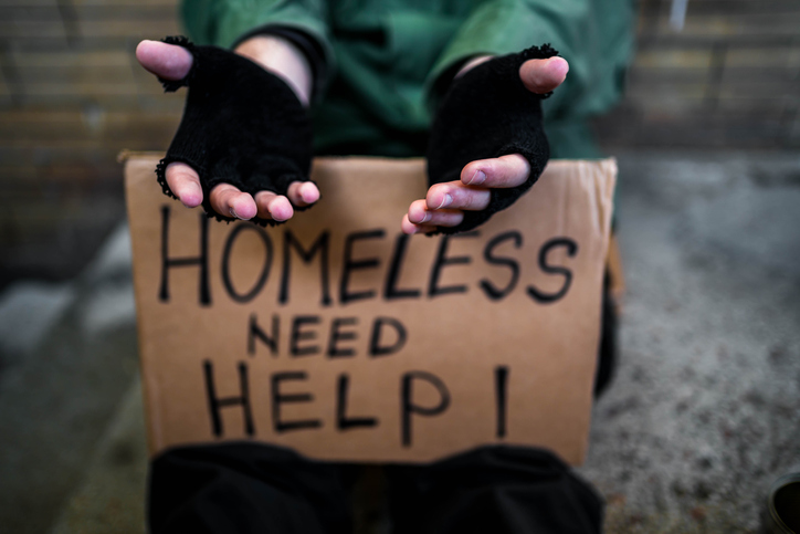 Homeless man begging for money on the street