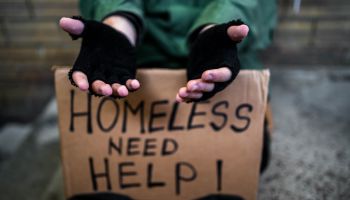 Homeless man begging for money on the street