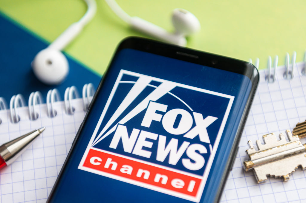 In this photo illustration, a Fox News logo seen displayed...