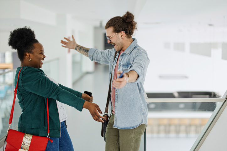 College students greet each other during an encounter