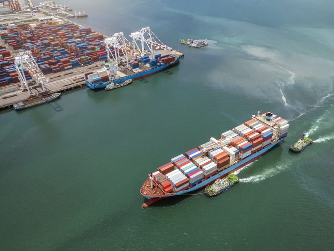 Aerial view Container cargo ship in the sea carrying to Terminal Port,Industry business logistic and transportation in Thailand