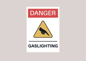 A gaslighting concept, mental health problems in relationships, a sign decorated as an industrial warning plate