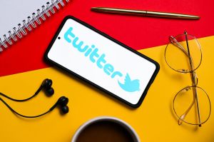 In this photo illustration a Twitter logo seen displayed on...