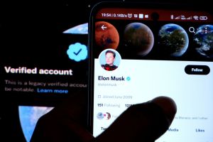 In this photo illustration, Elon Musk's twitter account seen...