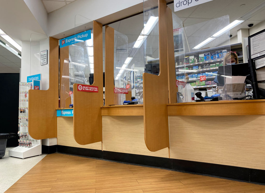 Narcotics in Time-delay safe sign at Walgreens Pharmacy Pick-up window, Queens, New York