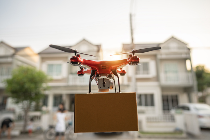 Editorial On 23 February 2020, Bangkok, Thailand Delivery drone flying in city. IMPORTANT NOTICE: Drone made by me from households items exclusively