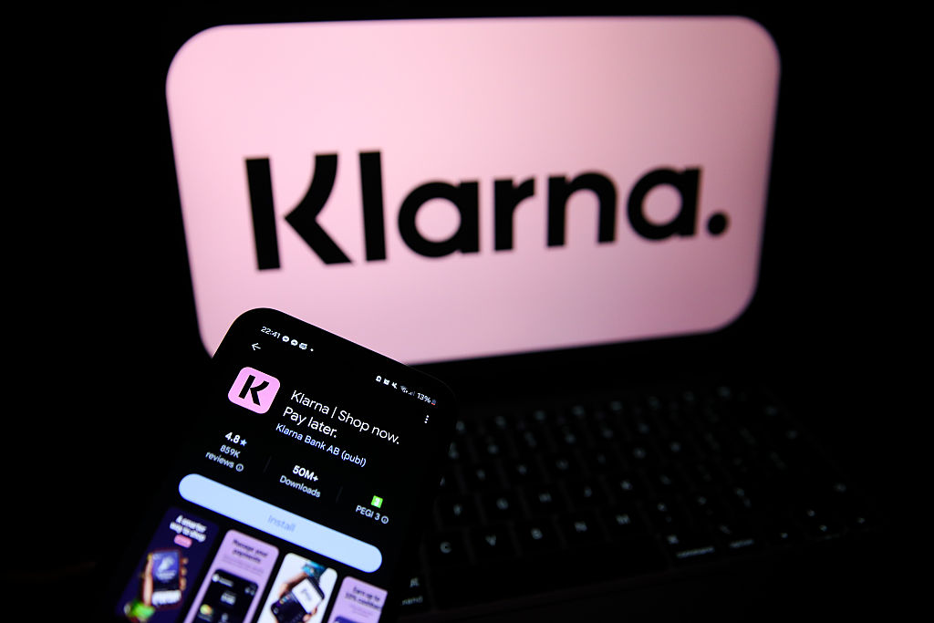 Logos Of Large Companies On Laptop