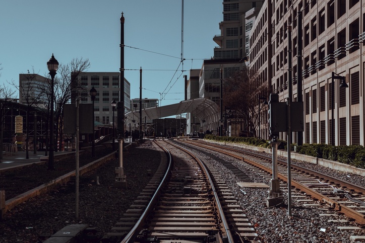 Railway road surrounded by buildings under sunlight in Charlotte in North Carolina