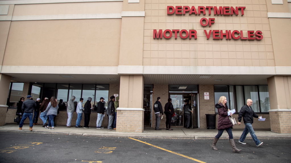 People Wait Outside a Department of Motor Vehicles Office On Long Island on January 31, 2020.