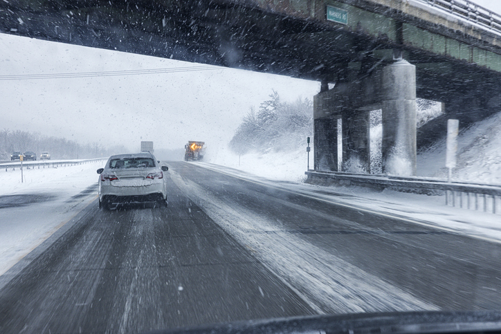 Expressway Snow Plow Truck During Winter Snow Blizzard