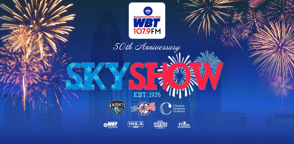 Fireworks display over a city skyline with text "SKYSHOW EST. 1976" and logos for WBTV, Knights, Hornets, and Charlotte Symphony Orchestra.