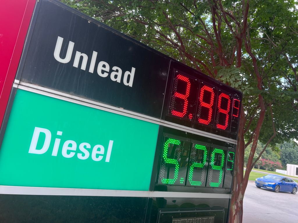 Outdoor gas station display showing "Unlead" price of $3.99 and "Diesel" price of $5.208.