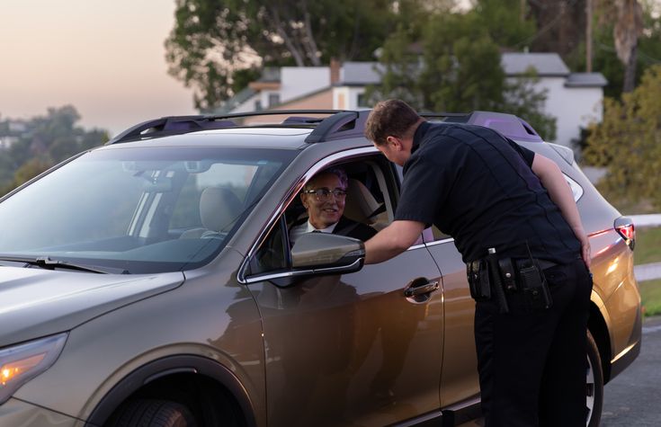 Driver Smiles at Police Officer During Traffic Stop